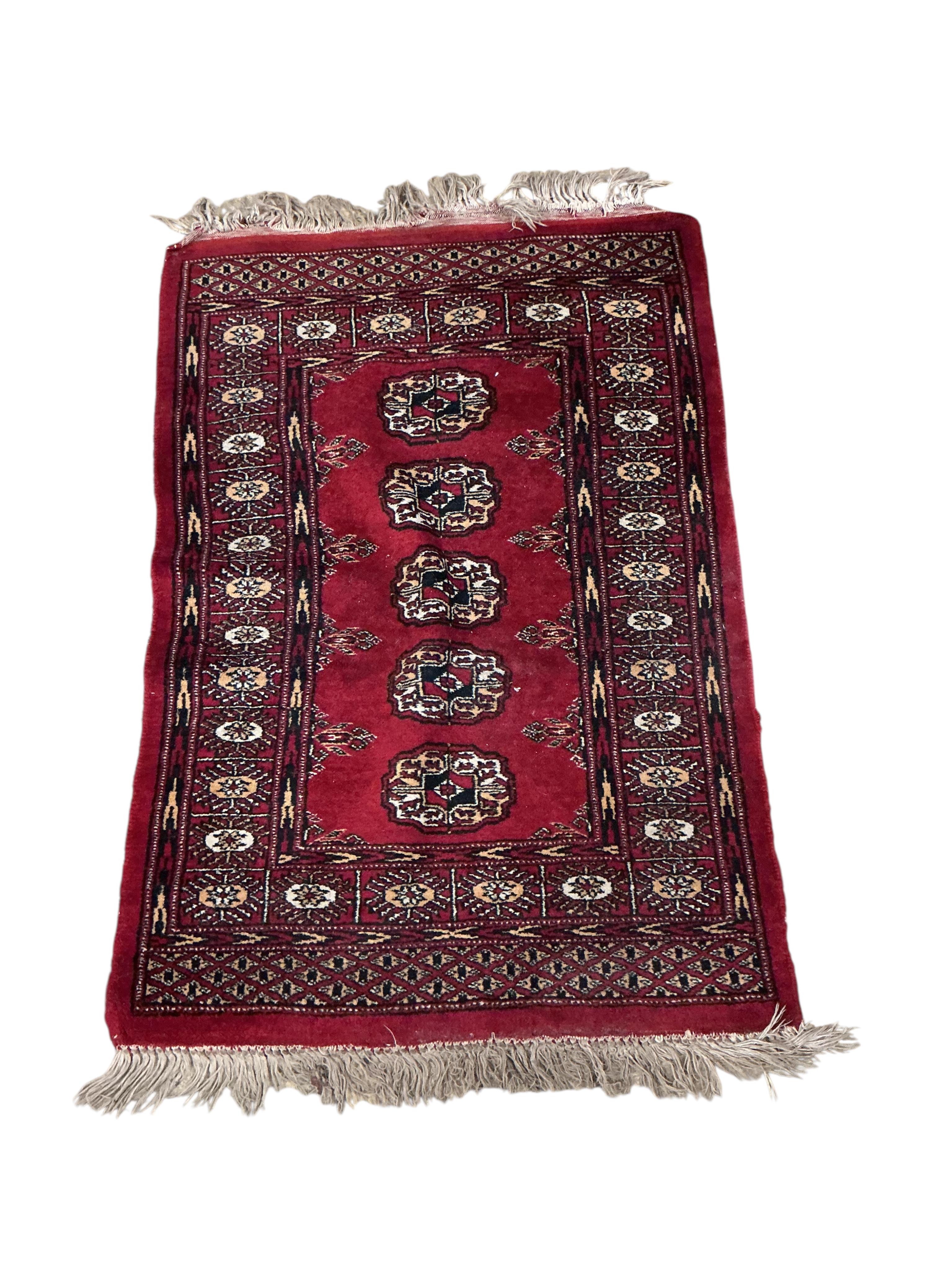 An Afghan blue ground rug 208 x 116cm, an Afghan mat and two Bokhara rugs